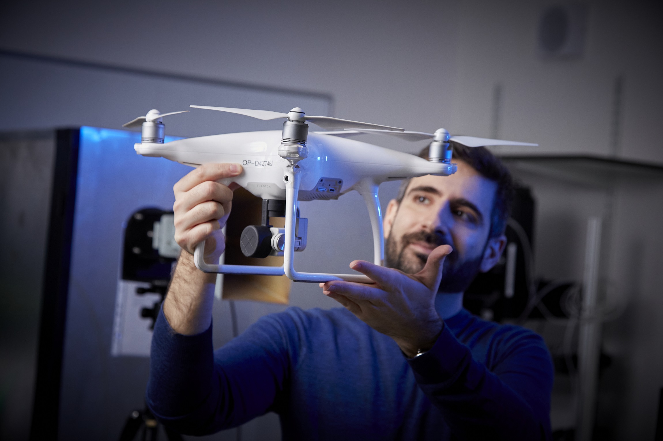 A man holding a drone